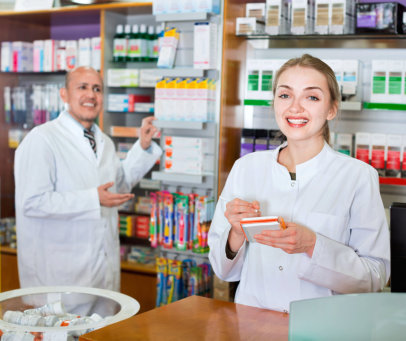 Friendly professional pharmaceutists at drugstore