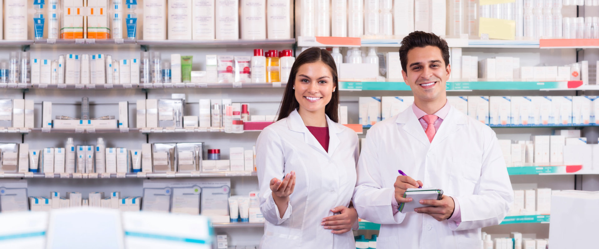Smiling pharmacist and techician at the pharmacy