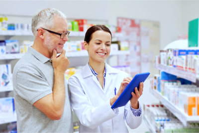 Senior man and a Pharmacist on a tablet pc